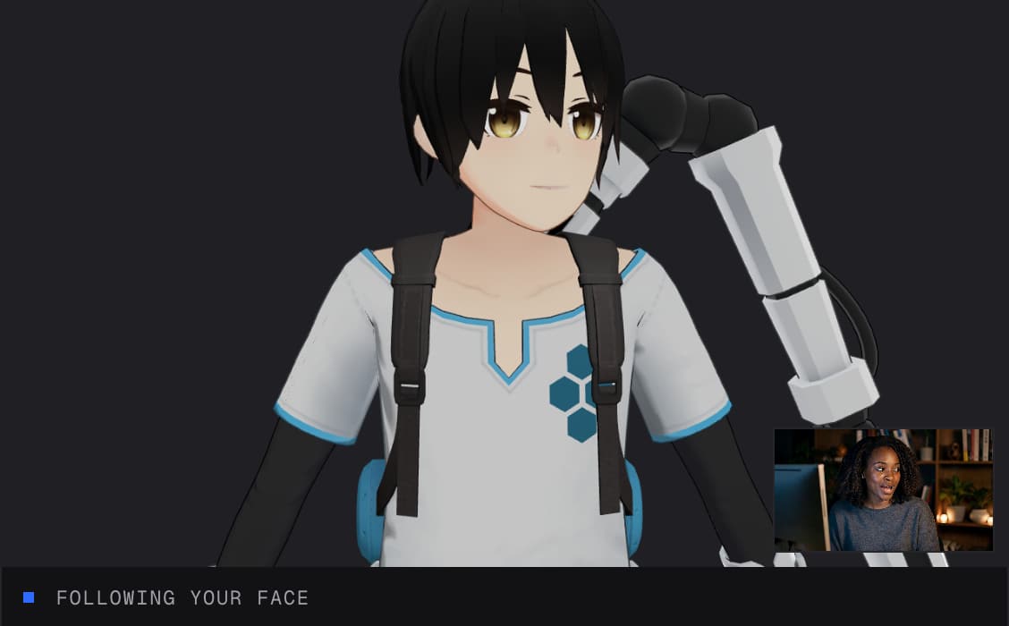 VTuber Maker running: the sample 3D avatar copies a webcam, with the camera preview in the corner